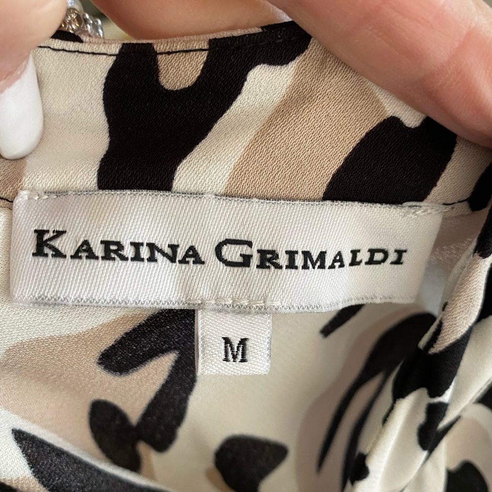 Animal print Romper!  Crepe material, details galore… size M worn a couple times